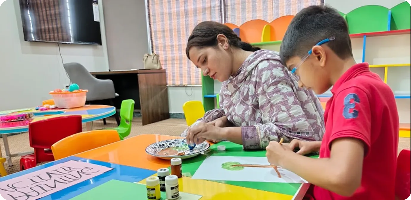 Students painting together at Odyssey School System